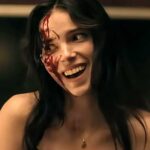 inde-navarrette-as-nikki-smiling-while-covered-in-blood-in-obsession-2026.jpg